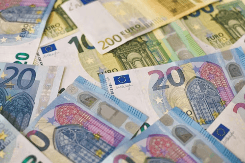 A spread of banknotes representing pricing